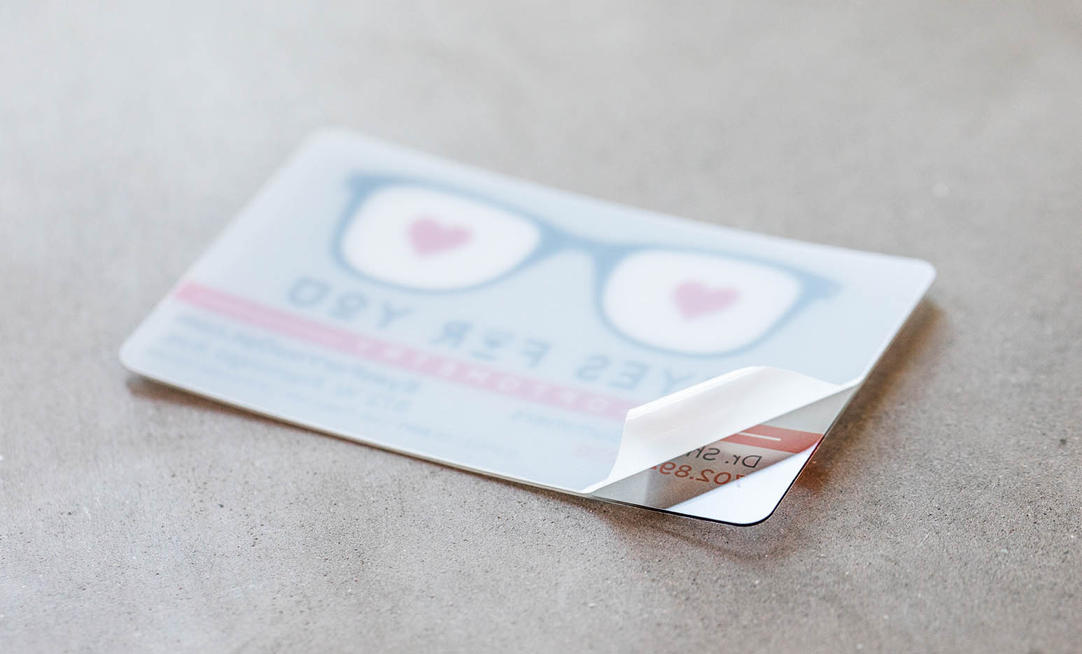 Clear Plastic Cards All our Clear Plastic Business Cards come with a protective film to prevent them from scratching during production and/or shipping.