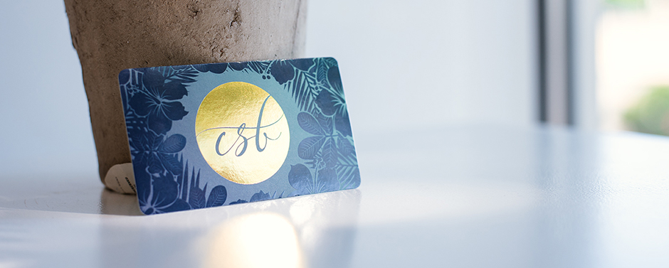 Business card with Gold Stamped Foil and Spot UV Absolutely stunning! Flowers were produced using a "Blind Spot UV" technique. Logo is stamped with Gold Foil. TIP: Be sure to keep Spot UV and Gold Foil at least 1/8inch away from each other.
