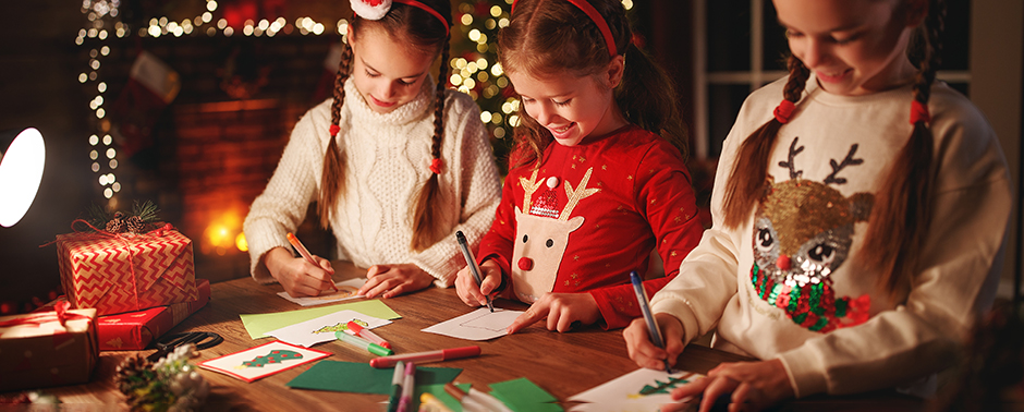 Children making Christmas Cards. Send holiday cards to senior living residents.